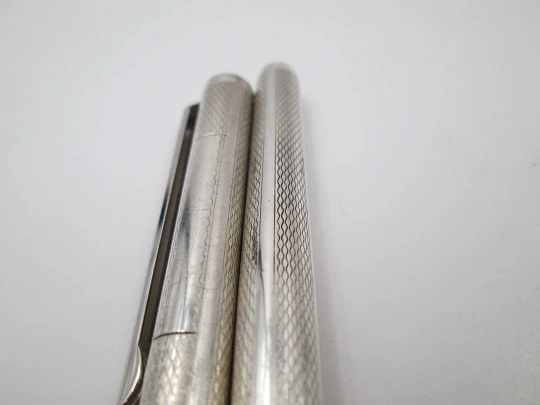 Rollerball pen. 925 sterling silver. Rhomboidal guilloche & vertical stripes. 1980's. Europe