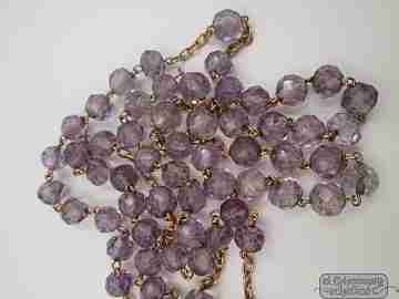 Rosary. 18 karat yellow gold and faceted amethyst-colored glass. 1950's. Spain