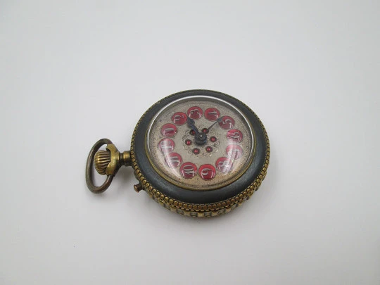 Roskopf System. Iron and gold plated. 1900. Swiss. Silver and red enamel dial