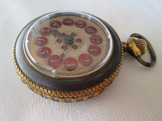 Roskopf System. Iron and gold plated. 1900. Swiss. Silver and red enamel dial