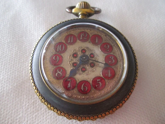 Roskopf System. Iron and gold plated. 1900. Swiss. Silver and red enamel dial