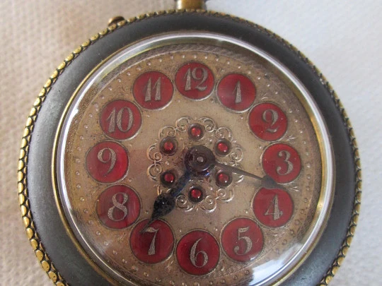 Roskopf System. Iron and gold plated. 1900. Swiss. Silver and red enamel dial