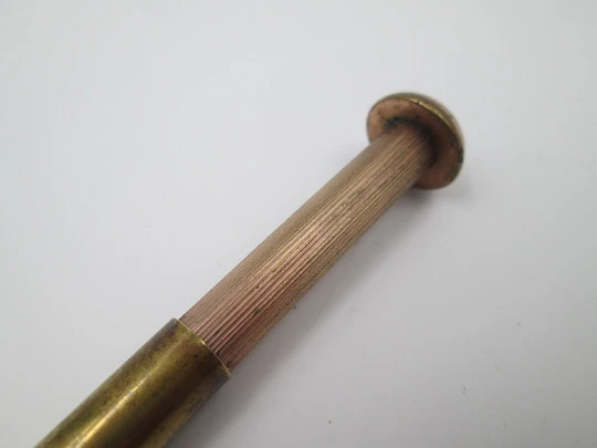Rotating telescopic mechanical pencil. Gold plated metal. Screw shape. 1910