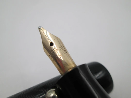 Royal. Black hard rubber and bitone metal. 14 karat gold nib. Lever filler. USA. 1920's