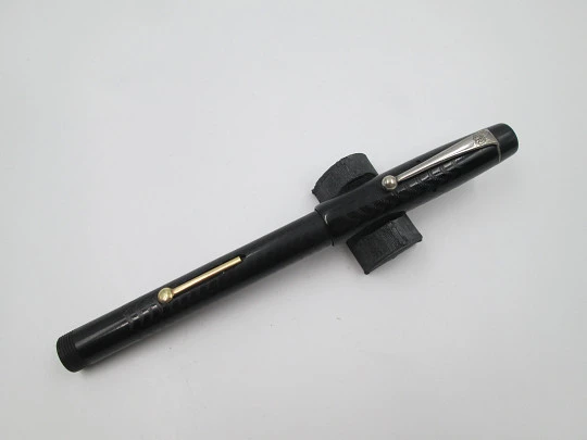 Royal. Black hard rubber and bitone metal. 14 karat gold nib. Lever filler. USA. 1920's