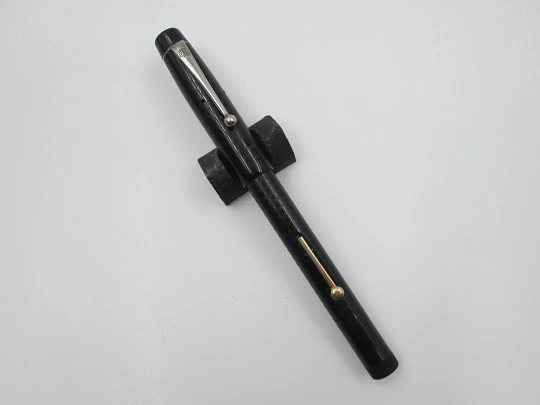 Royal. Black hard rubber and bitone metal. 14 karat gold nib. Lever filler. USA. 1920's