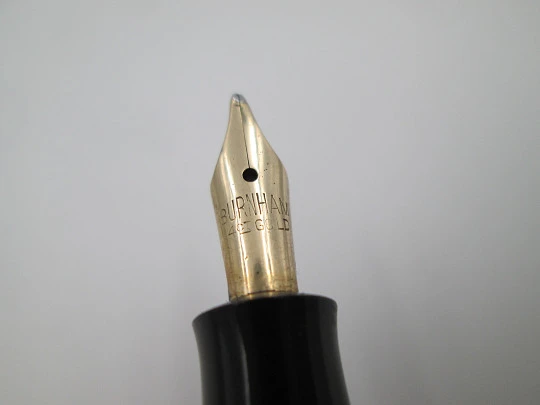 Royal. Black hard rubber and bitone metal. 14 karat gold nib. Lever filler. USA. 1920's