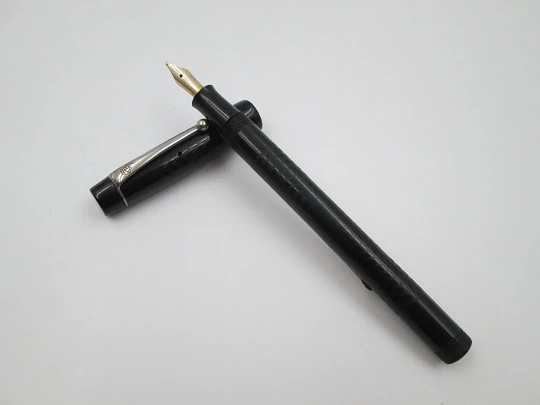 Royal. Black hard rubber and bitone metal. 14 karat gold nib. Lever filler. USA. 1920's