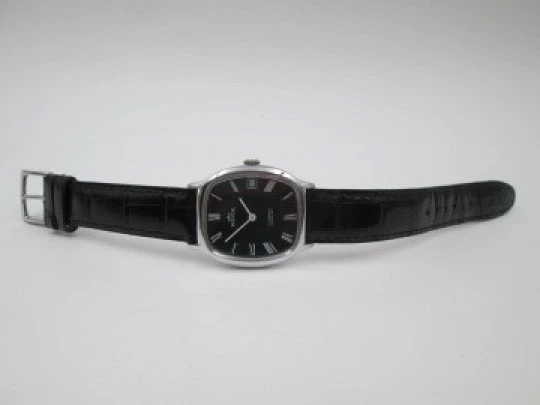 Royce. Stainless steel. Manual wind. Calendar. Black dial. Strap. 1970's. Swiss