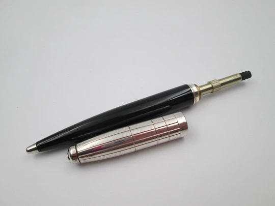 S. T. Dupont ballpoint pen. Black resin and platinum plated. Twist system. 1990's. France