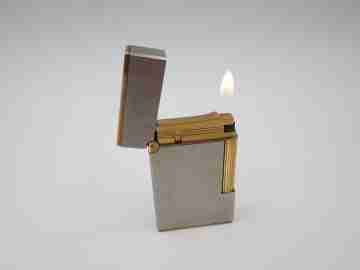 S. T. Dupont Paris gas lighter. Satin steel & golden metal. France. 1990's