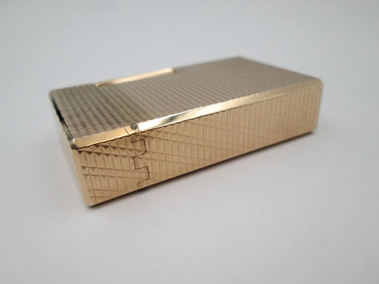 S. T. Dupont Paris lighter. Gold plated. Geometric pattern. France. 1990's