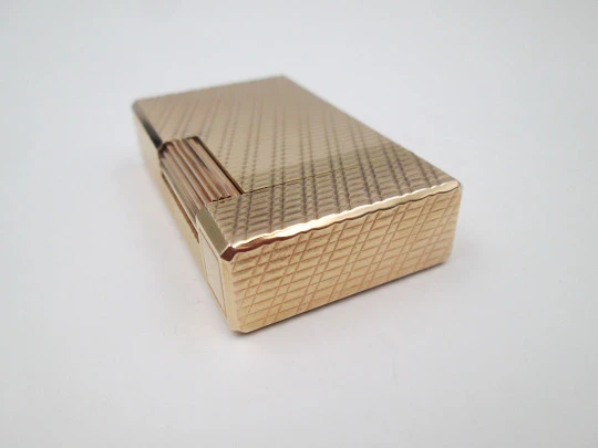 S. T. Dupont Paris lighter. Gold plated. Geometric pattern. France. 1990's