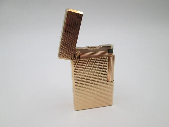 S. T. Dupont Paris lighter. Gold plated. Geometric pattern. France. 1990's