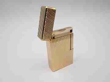 S. T. Dupont Paris lighter. Gold plated. Geometric pattern. France. 1990's