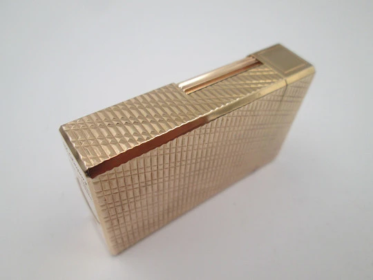 S. T. Dupont Paris lighter. Gold plated. Geometric pattern. France. 1990's