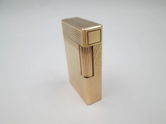 S. T. Dupont Paris lighter. Gold plated. Geometric pattern. France. 1990's