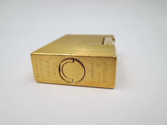 S.T. Dupont lighter. Gold plated metal. Lines pattern & anagram. 2001