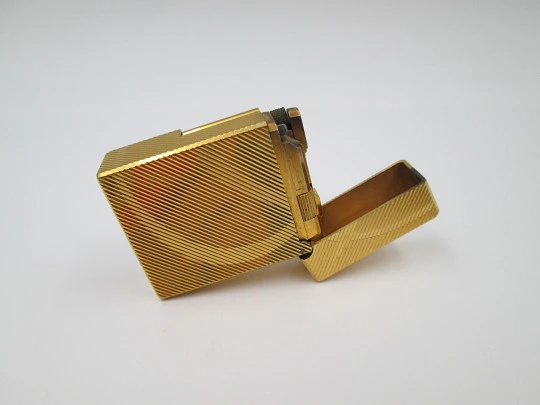 S.T. Dupont lighter. Gold plated metal. Lines pattern & anagram. 2001