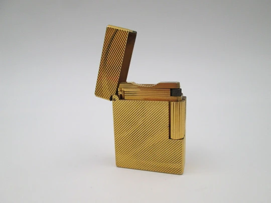 S.T. Dupont lighter. Gold plated metal. Lines pattern & anagram. 2001