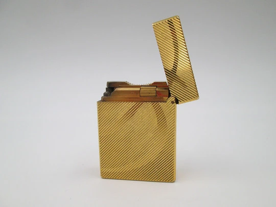 S.T. Dupont lighter. Gold plated metal. Lines pattern & anagram. 2001