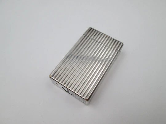 S.T. Dupont lighter. Silver plated metal. Lines pattern. Original box. 1990's