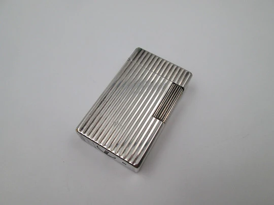 S.T. Dupont lighter. Silver plated metal. Lines pattern. Original box. 1990's