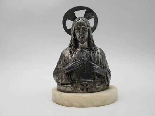 Sacred Heart of Jesus sculpture. Pewter and white marble oval stand. Spain. 1940's