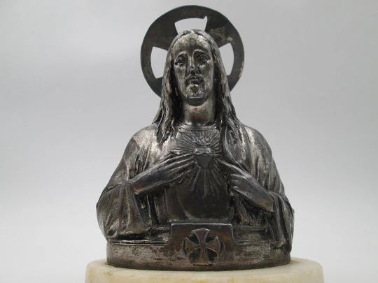 Sacred Heart of Jesus sculpture. Pewter and white marble oval stand. Spain. 1940's