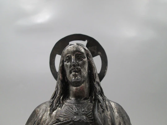 Sacred Heart of Jesus sculpture. Pewter and white marble oval stand. Spain. 1940's