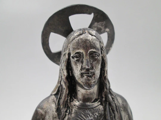 Sacred Heart of Jesus sculpture. Pewter and white marble oval stand. Spain. 1940's