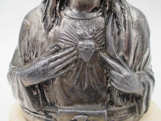 Sacred Heart of Jesus sculpture. Pewter and white marble oval stand. Spain. 1940's