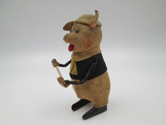 Schuco pied piper pig toy. Tinplate and colours felt. Clockwork mechanism. Germany. 1930's