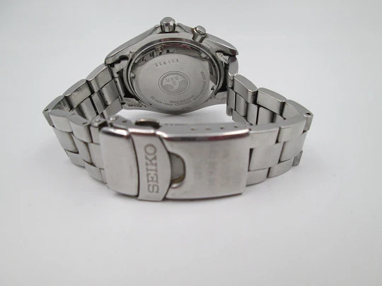 Seiko Kinetic. Acero inoxidable. Día y fecha. Brazalete. Dial blanco. Japón. 1990
