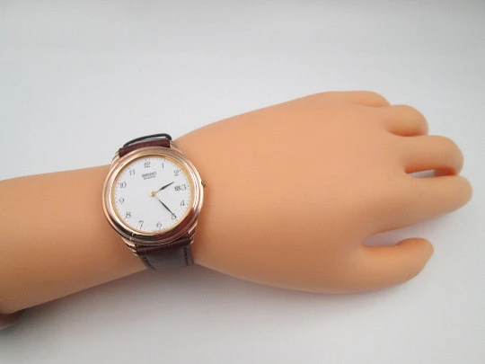 Seiko men's dress quartz watch. Gold plated and stainless steel. Calendar. Japan. 1980's Seiko men's dress quartz watch. Gold plated and stainless steel. Calendar. Japan. 1980's