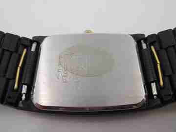 Seiko. Black and gold metal. Steel back. Quartz. Square case. Bracelet. 1980's. Japan