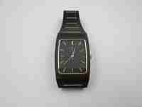 Seiko. Black and gold metal. Steel back. Quartz. Square case. Bracelet. 1980's. Japan