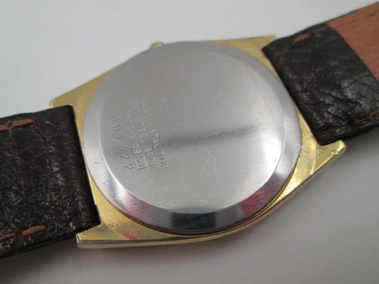Seiko. Gold plated and stainless steel. Quartz movement. Rectangular case. Japan. 1980's