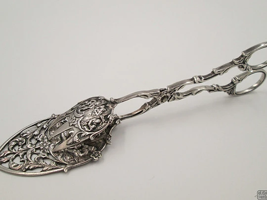 Serving tongs. Sterling silver. Openwork design. Relief scenes