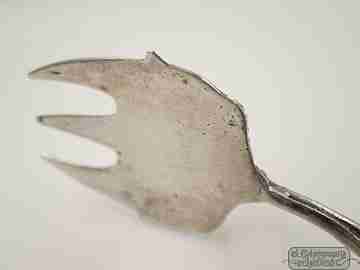 Serving tongs. Sterling silver. Openwork design. Relief scenes