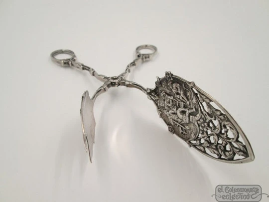 Serving tongs. Sterling silver. Openwork design. Relief scenes