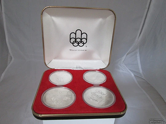 Set four sterling silver coins. Box. 1970's. Canada Olympics. Dollars