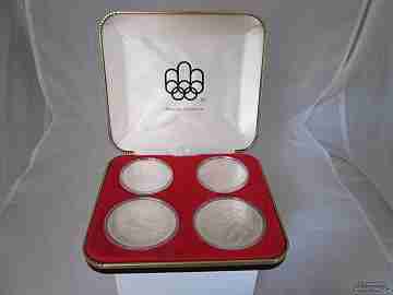 Set four sterling silver coins. Box. 1970's. Montreal Olympics. Dollars