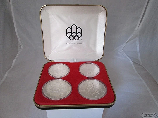 Set four sterling silver coins. Box. 1970's. Montreal Olympics. Dollars