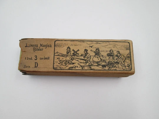 Set of 14 magic lantern slides. Original carboard box. Children's colour images. 1900's