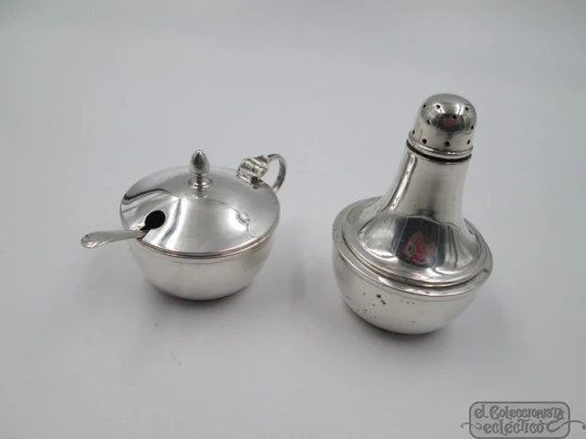 Set of salt cellar with spoon and pepper shaker with stand. Silver. 1940's