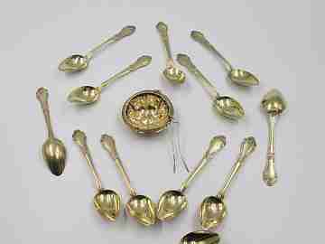 Set twelve dessert spoons & tea strainer. 800 vermeil silver. 1900's