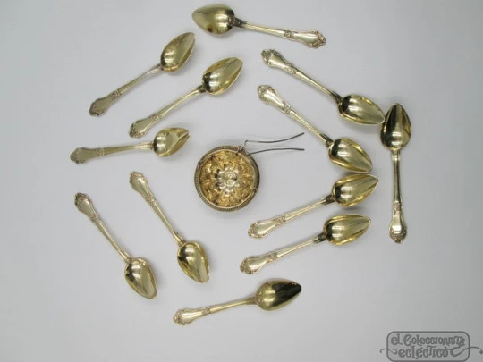 Set twelve dessert spoons & tea strainer. 800 vermeil silver. 1900's