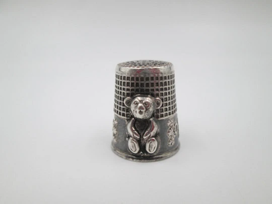 Sewing thimble. Sterling silver. Bear relief figure and vegetable motifs. Europe. 1960's