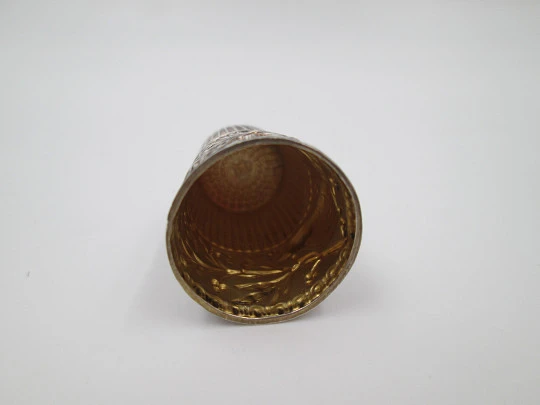 Sewing thimble. Sterling silver. Bird with leaves relief motif. Golden inside. 1960's